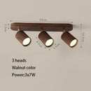 Surface mounted LED spotlight with replaceable bulb and adjustable heads