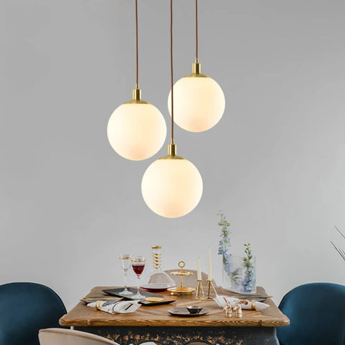 Modern minimalist brass pendant light with luminous orb - vue 4 sur 9