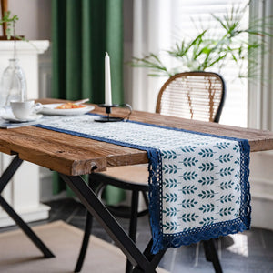 Navy blue lace table runner with porcelain motif