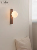 Retro walnut wall light with decorative glass