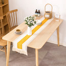 Linen-effect table runner with decorative check pattern