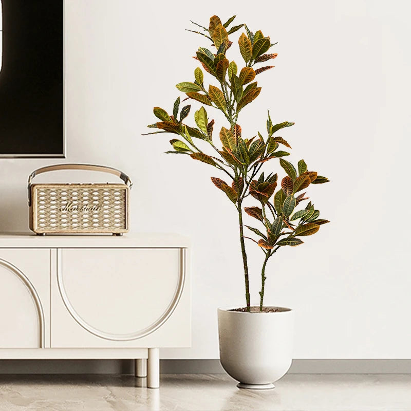 Large artificial tropical plants ficus and codiaeum for indoor decor