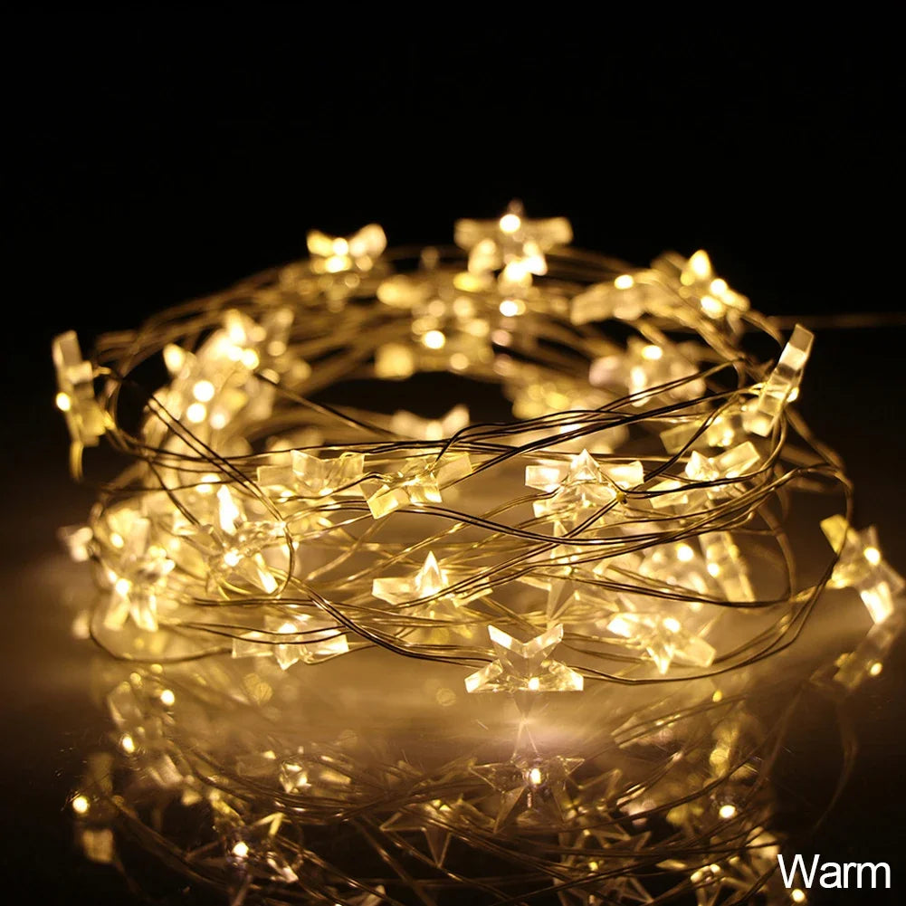 Copper wire string lights with decorative stars, battery operated
