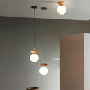 Round glass LED ceiling light with wooden lampshade