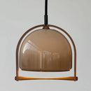 Modern glass and wood pendant light with adjustable height for indoor use