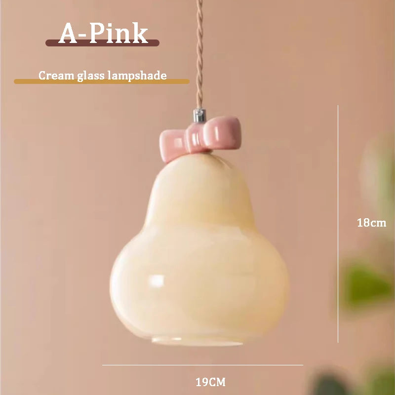 Glass pendant light with pink bow for children's room
