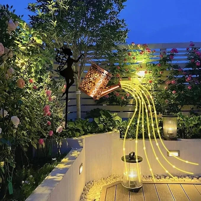 Fairy garden decoration with watering can and solar lanterns