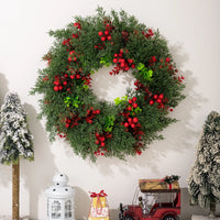 Artificial Christmas wreath with decorative red berries