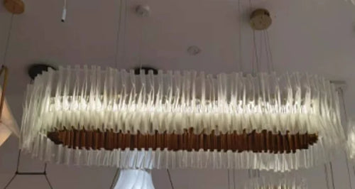 Designer pendant light in PVC and stainless steel for indoor spaces