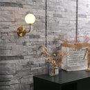 Nordic retro wall lamp with curved metal and glass globe