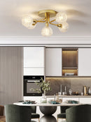 Modern glass ceiling light with round gold wave shade