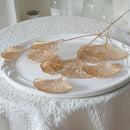 Set of artificial ginkgo, eucalyptus and holly leaves for floral decoration