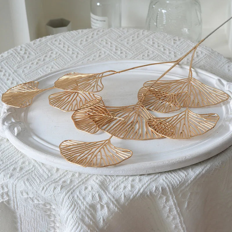 Set of artificial ginkgo, eucalyptus and holly leaves for floral decoration