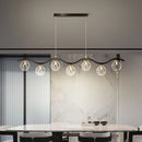 Modern glass and metal pendant light for interiors