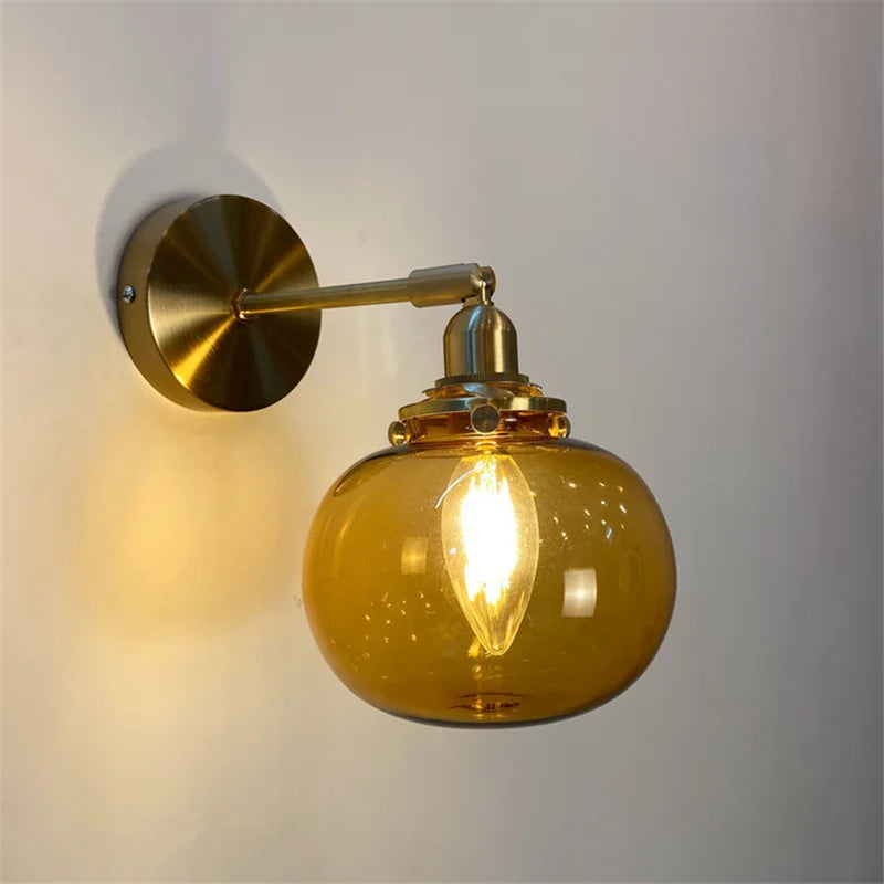 Retro brass and glass wall light with elegant design for interiors