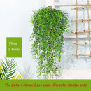 Rattan wall decoration with leaves and golden bell