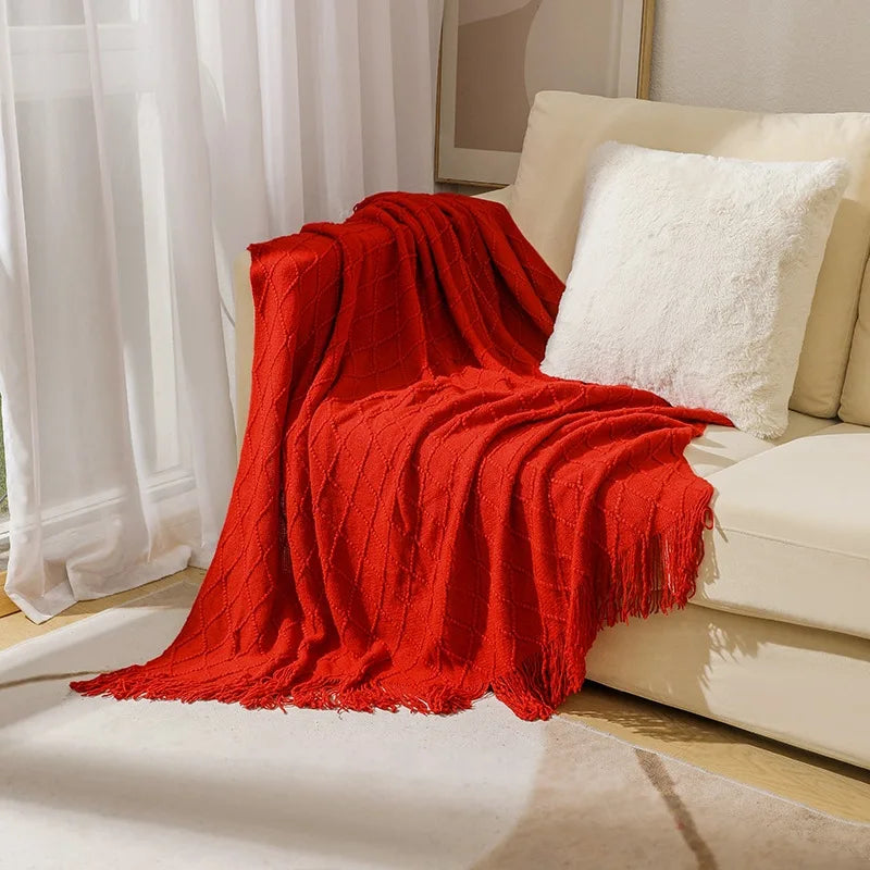 Jacquard knitted throw with pompom and check pattern for living room