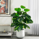 Artificial tropical turtle with decorative branches and leaves