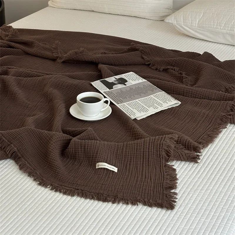 Soft cotton checked throw with pompoms for living room