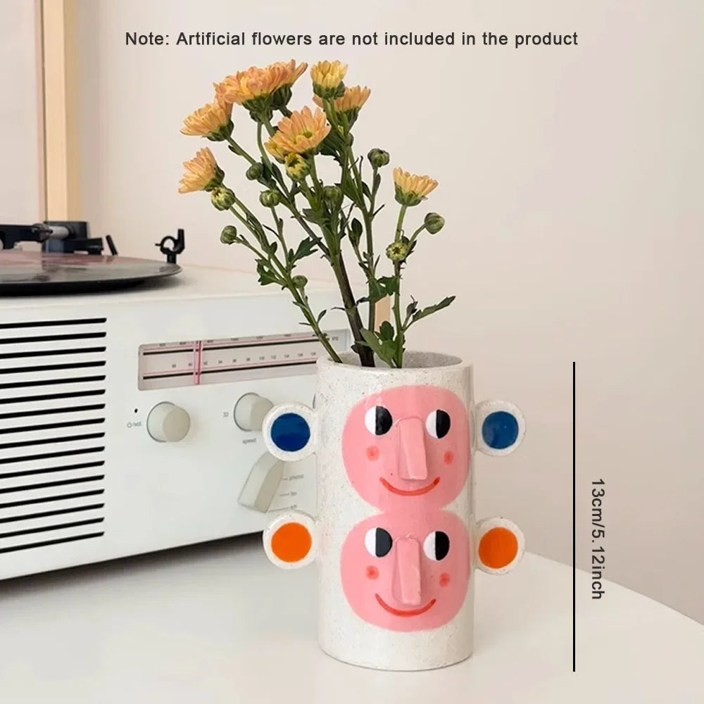 abstract ceramic vase with human face floral decoration