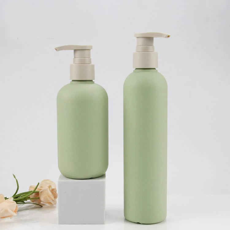 set of plastic bottles with pump lid for cosmetics