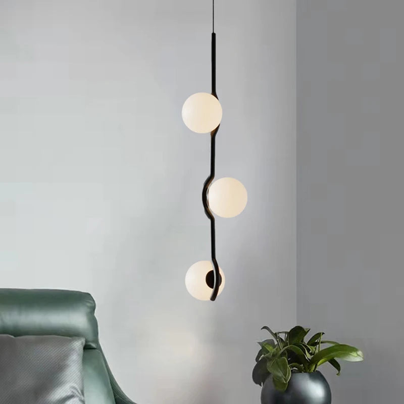 Simple glass and metal pendant light with adjustable wire