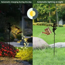 Solar watering can with garden lights and fairy statues