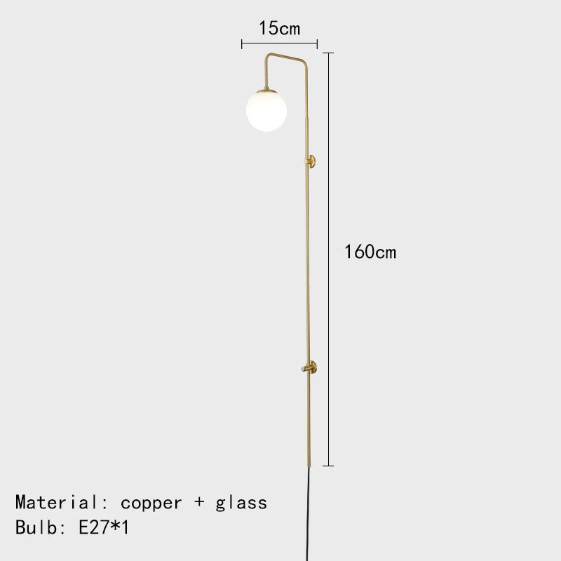 Minimalist brass wall light with white glass