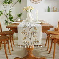 Embroidered boho plant table runner with cotton tassels
