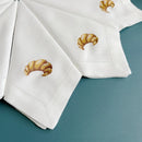 Embroidered linen napkin with croissant motif, customisable