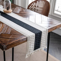 Beige boho table runner with geometric patterns and tassels
