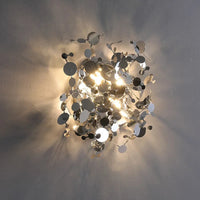 Modern stainless steel wall light with decorative leaves