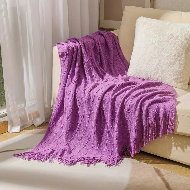 Acrylic knitted throw blanket with chequered pattern and pompom trim for living room or bedroom