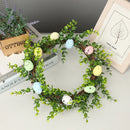 Decorative Easter wreath with bunny and hanging eggs