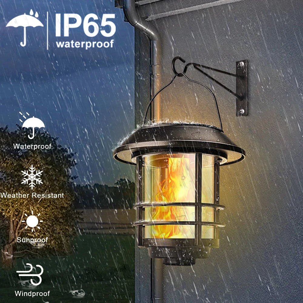 Hanging solar lantern with flickering flame for outdoor use