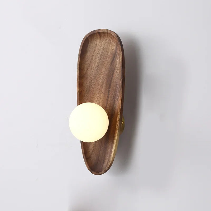 Natural wood wall lamp with vintage glass shade