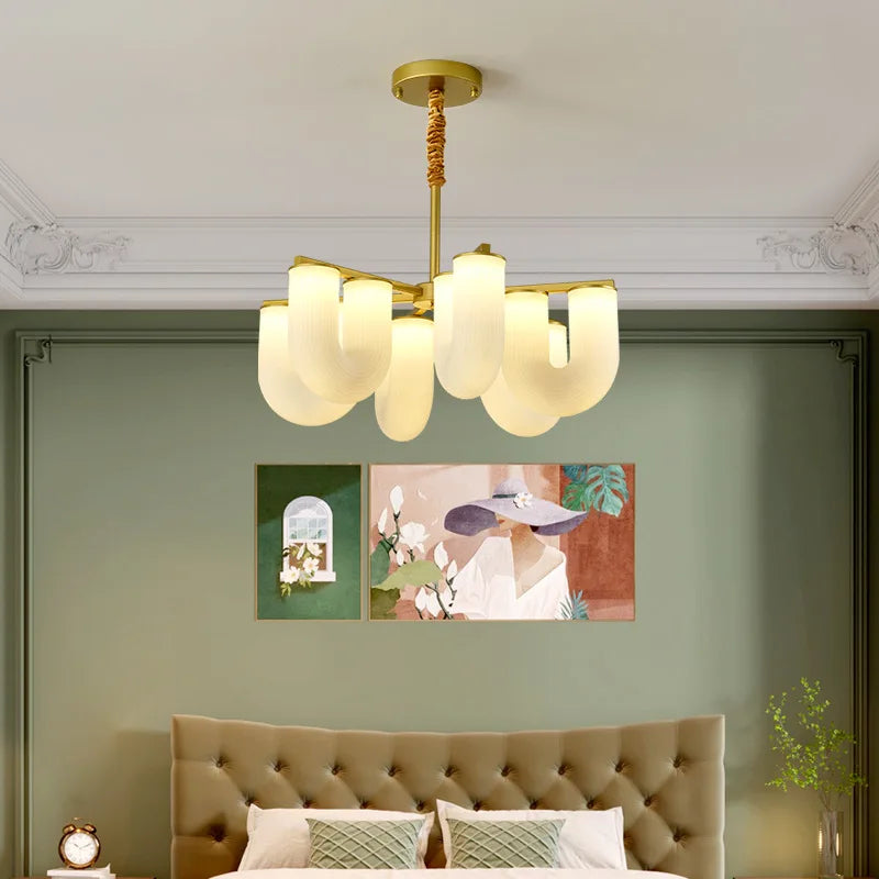 Modern chandelier in acrylic and gold metal for elegant interiors
