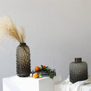 clear glass vase with black dots for decoration and floral arrangements