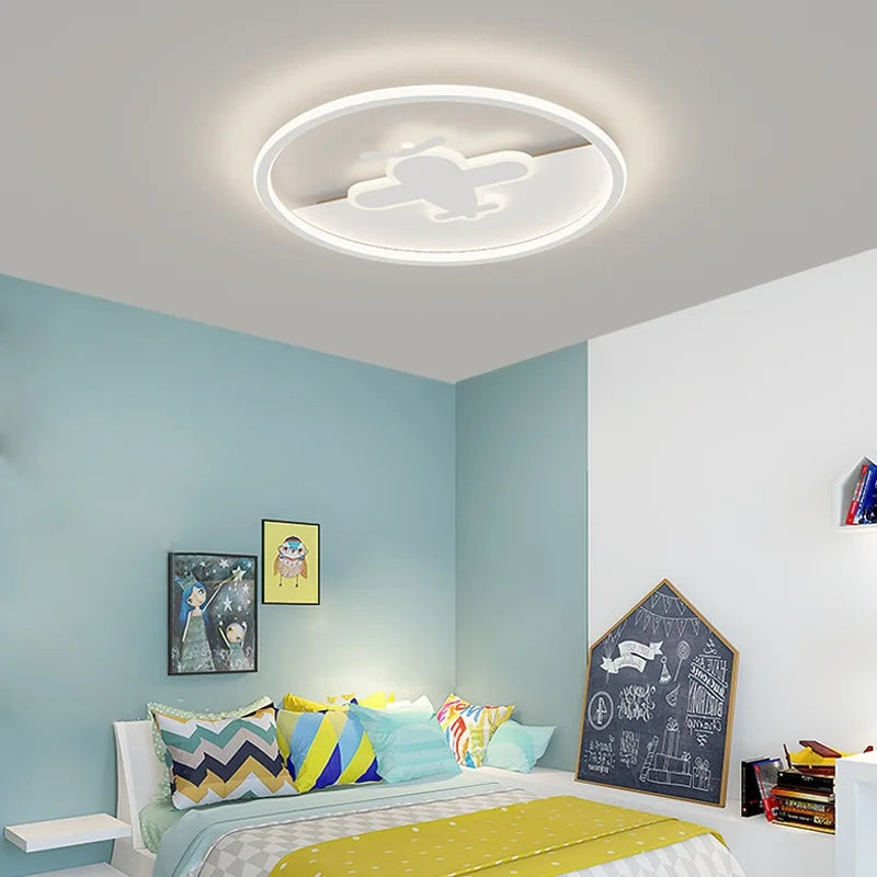 Scandinavian round ceiling light with airplane and cloud motif for children