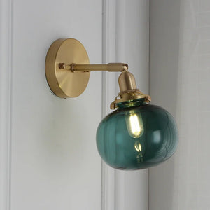 Modern wall light with pull chain and glass globe