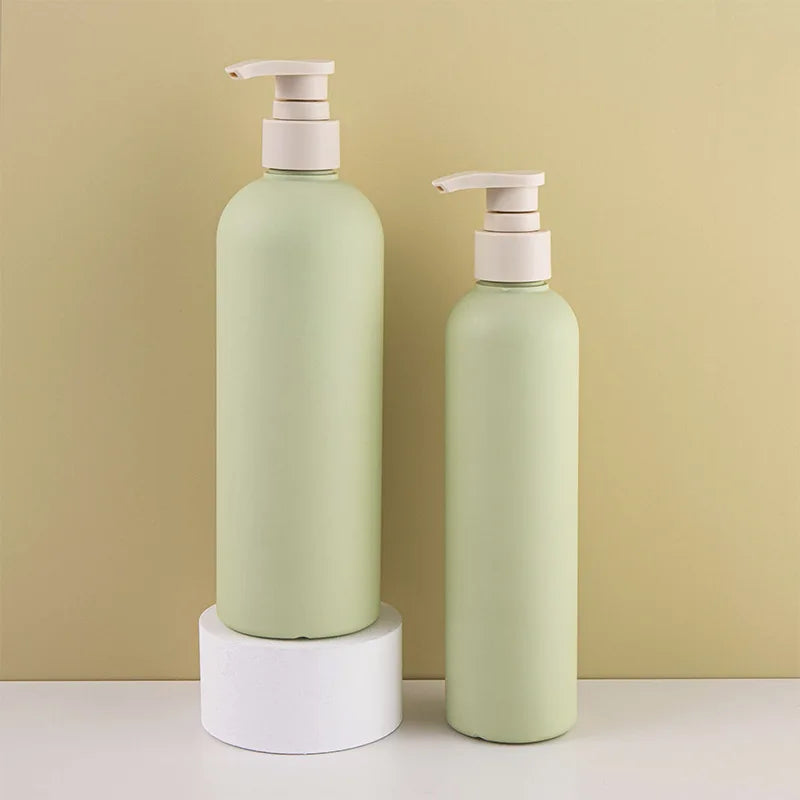 set of plastic bottles with pump lid for cosmetics
