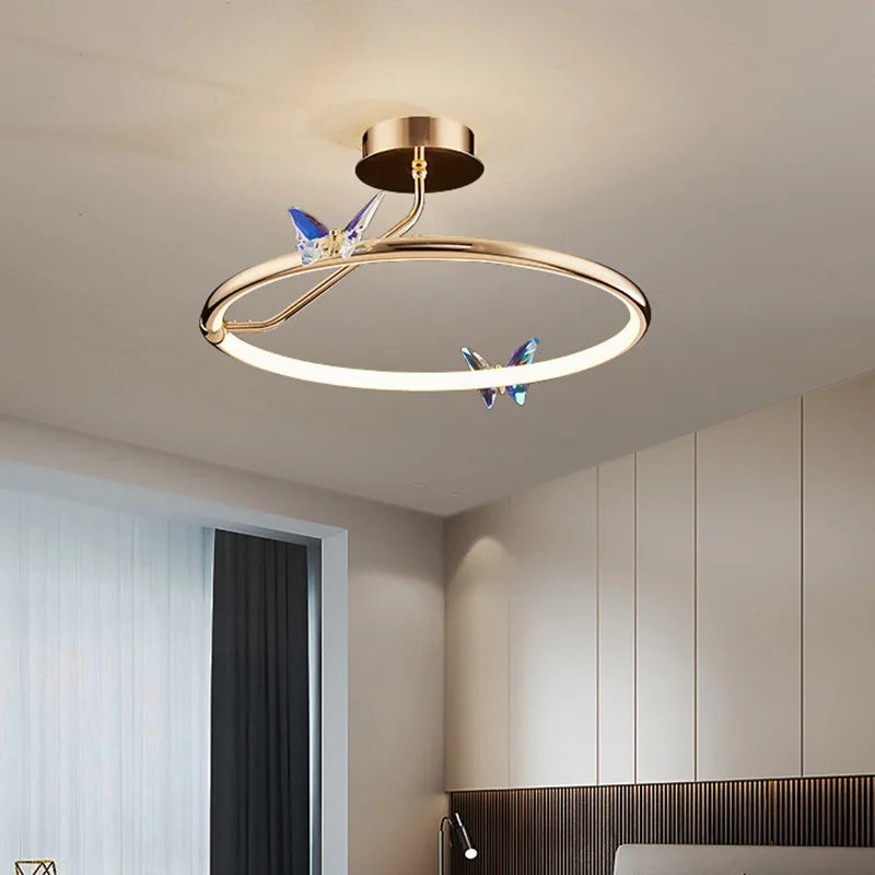 Gold ring LED pendant light with butterfly motif