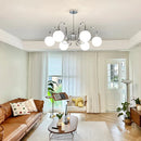 Modern chrome chandelier with glass pendant