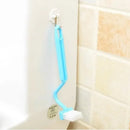 Wall-mounted curved toilet brush with soft bristles