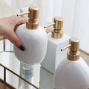ceramic soap dispenser with gold pump for bathroom