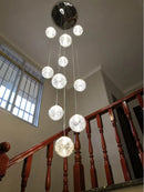 Glass ball pendant light for modern stairwell lighting
