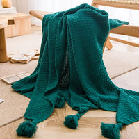 Chunky waffle knit throw with pom poms nordic style