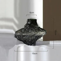 glass vase with decorative stones for flowers and terrarium