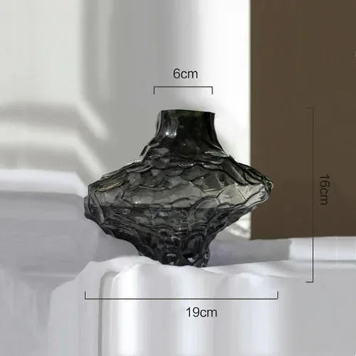 glass vase with decorative stones for flowers and terrarium