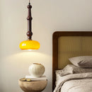 Rubber wood and glass pendant light for modern interiors